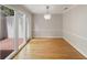 Spacious dining room with hardwood floors and a sliding glass doors to a private patio at 987 Harbor Oaks Dr, Charleston, SC 29412