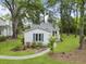 This single story home features light siding, manicured lawn, and a charming walkway to the front entrance at 987 Harbor Oaks Dr, Charleston, SC 29412