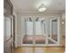 Inviting foyer with hardwood floors and a view into an outdoor patio through large windows at 987 Harbor Oaks Dr, Charleston, SC 29412