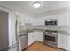 Well-equipped kitchen with stainless steel appliances, granite countertops, and white cabinetry at 987 Harbor Oaks Dr, Charleston, SC 29412