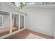 Private brick patio accessible through large glass windows, providing a serene outdoor space at 987 Harbor Oaks Dr, Charleston, SC 29412