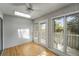 Sunroom featuring hardwood floors, a skylight, and views of the backyard at 987 Harbor Oaks Dr, Charleston, SC 29412