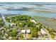 Wide angle aerial view showcases waterfront community with private docks surrounded by beautiful green foliage at 1014 E Erie Ave, Folly Beach, SC 29439