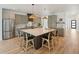 Spacious kitchen featuring a large central island with seating, stylish cabinetry, and modern design at 1014 E Erie Ave, Folly Beach, SC 29439