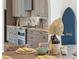 Open-concept kitchen featuring stainless steel appliances, custom cabinetry, and modern decor at 1014 E Erie Ave, Folly Beach, SC 29439