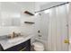Bright bathroom featuring a marble countertop, elegant gold fixtures, and subway tile shower at 103 Tall Oak Ave, Charleston, SC 29407