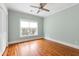 Sunny bedroom with hardwood floors, ceiling fan, and large window with natural light at 103 Tall Oak Ave, Charleston, SC 29407