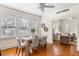 Sunlit dining room features a wooden table and views into the living room at 103 Tall Oak Ave, Charleston, SC 29407