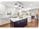 Modern kitchen with white cabinets, stainless steel appliances, and a large kitchen island at 103 Tall Oak Ave, Charleston, SC 29407