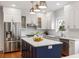 Bright kitchen with white cabinets, a center island, and stainless steel appliances at 103 Tall Oak Ave, Charleston, SC 29407
