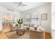 Cozy living room boasts an area rug and is adjacent to the kitchen and dining area at 103 Tall Oak Ave, Charleston, SC 29407