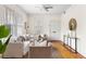 Bright living room featuring hardwood floors, neutral furniture, and a modern ceiling fan at 103 Tall Oak Ave, Charleston, SC 29407