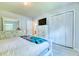 Bright bedroom featuring a large dresser with mirror and white closet doors at 106 Trimley Ct, Goose Creek, SC 29445