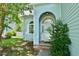 Close up of the front entry with a half round window over the door and brick steps at 106 Trimley Ct, Goose Creek, SC 29445