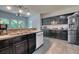 Kitchen view highlighting the dark cabinetry, stainless steel appliances, and spacious layout at 106 Trimley Ct, Goose Creek, SC 29445
