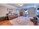 Cozy living room with hardwood floors, leather sofa, and decorative rug at 106 Trimley Ct, Goose Creek, SC 29445