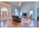 Spacious living room with high ceilings, hardwood floors, and lots of natural light at 106 Trimley Ct, Goose Creek, SC 29445