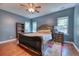 Spacious main bedroom featuring hardwood floors, neutral paint, and a decorative ceiling fan at 106 Trimley Ct, Goose Creek, SC 29445