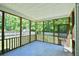 A cozy screened porch with wood trim offers an inviting space for relaxation and enjoying the outdoors at 106 Trimley Ct, Goose Creek, SC 29445