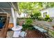 Charming backyard patio featuring a hammock, potted plants, and string lights for evening ambiance at 107 Clear Bend Ln, Summerville, SC 29486