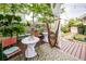 Inviting backyard patio with comfortable seating, charming decor, and lush greenery for relaxing outdoor living at 107 Clear Bend Ln, Summerville, SC 29486