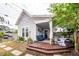 Inviting backyard patio with comfortable seating, lush greenery, and wooden deck at 107 Clear Bend Ln, Summerville, SC 29486
