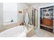 Bright bathroom featuring a soaking tub, shower, and walk-in closet at 107 Clear Bend Ln, Summerville, SC 29486