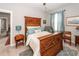 Bright bedroom showcasing a carved wood bed frame, complemented by soft blue accents and a calm ambiance at 107 Clear Bend Ln, Summerville, SC 29486