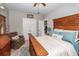 Bright bedroom showcasing a carved wood bed frame, complemented by soft blue accents and a calm ambiance at 107 Clear Bend Ln, Summerville, SC 29486