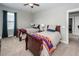 Bedroom features two twin beds, ceiling fan, neutral walls and is decorated with dark blue curtains at 107 Clear Bend Ln, Summerville, SC 29486