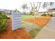 Signage in the common area pointing towards POA Offices and Annex set in a well-maintained landscape at 107 Clear Bend Ln, Summerville, SC 29486