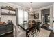 Elegant dining room with a chandelier, wooden table, and stylish decor at 107 Clear Bend Ln, Summerville, SC 29486