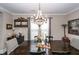 Traditional dining room featuring a wooden table with chairs and a decorative chandelier at 107 Clear Bend Ln, Summerville, SC 29486