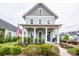 Charming two-story home with gray siding, inviting front porch, and manicured landscaping at 107 Clear Bend Ln, Summerville, SC 29486