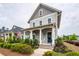Charming two-story home with gray siding, inviting front porch, and manicured landscaping at 107 Clear Bend Ln, Summerville, SC 29486