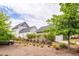View of the side and rear of the home showcasing manicured landscaping and exterior architectural details at 107 Clear Bend Ln, Summerville, SC 29486