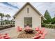 Outdoor fire pit area with Adirondack chairs for relaxing in a community gathering space at 107 Clear Bend Ln, Summerville, SC 29486