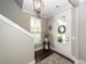 Inviting foyer with hardwood floors, stylish lighting, and a decorative wreath at 107 Clear Bend Ln, Summerville, SC 29486
