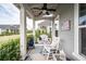 Inviting front porch with rocking chairs, ceiling fan, and charming decor at 107 Clear Bend Ln, Summerville, SC 29486