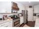 Well-equipped kitchen featuring granite countertops, stainless steel appliances, and custom cabinets at 107 Clear Bend Ln, Summerville, SC 29486