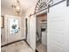 Bright laundry room features modern sliding door and a washing machine at 107 Clear Bend Ln, Summerville, SC 29486