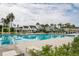 Community swimming pool featuring lounge chairs, umbrellas, and clear blue water on a sunny day at 107 Clear Bend Ln, Summerville, SC 29486