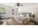 Bright bedroom with hardwood floors, ceiling fan, white walls and multiple windows with views at 108 Old Dominion Dr, North Charleston, SC 29418