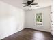 Bright bedroom featuring wood floors, ceiling fan, and a window with natural light at 108 Old Dominion Dr, North Charleston, SC 29418