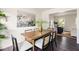 Dining area with a wood table, six chairs, and a swan print hanging on the wall at 108 Old Dominion Dr, North Charleston, SC 29418