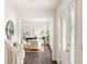 Light-filled foyer showcases a view into a sitting room and white front door at 108 Old Dominion Dr, North Charleston, SC 29418