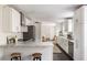A bright, renovated kitchen featuring white cabinets, granite countertops, and modern stainless steel appliances at 108 Old Dominion Dr, North Charleston, SC 29418