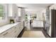 Modern kitchen featuring white cabinets, granite countertops, stainless steel appliances and view to the dining room at 108 Old Dominion Dr, North Charleston, SC 29418