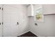 Clean laundry room with white cabinets, a window, and a white entry door at 108 Old Dominion Dr, North Charleston, SC 29418