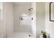 Bright white walk-in shower with tiled walls, a rainfall shower head and tiled niche at 108 Old Dominion Dr, North Charleston, SC 29418